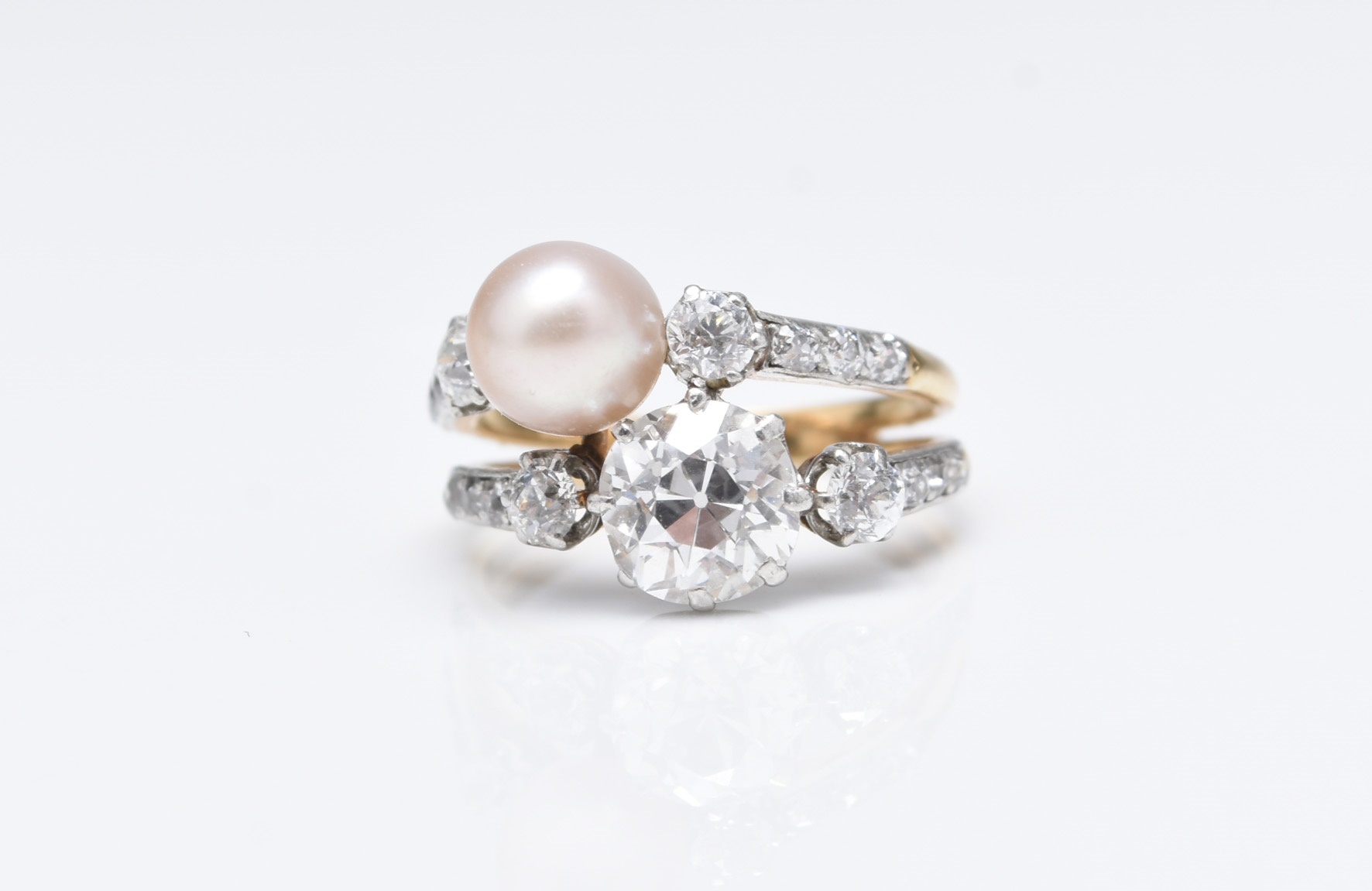 An early 20th century diamond and pearl crossover ring sold for £4,000. Halls Fine Art